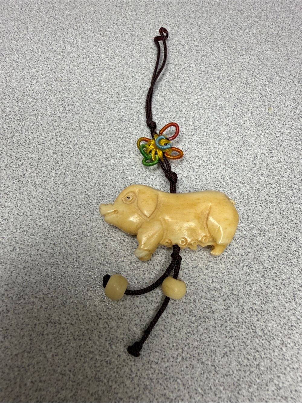 Ornate Source Unknown Zodiac Beige Pig Charm with Multicolor Knot Accent
